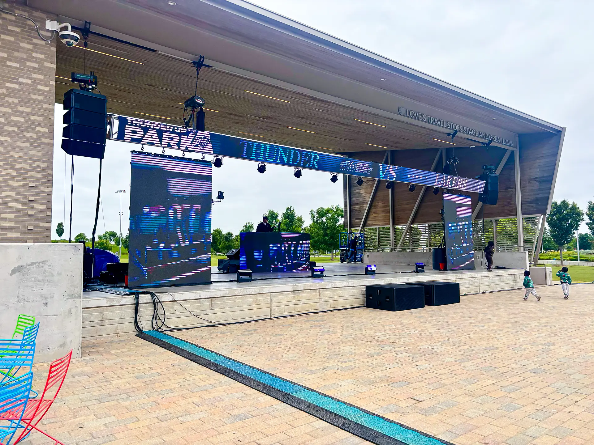 Outdoor Oklahoma City Thunder fan activation stage featuring LED video walls, professional audio systems, lighting, and DJ production support by CNS.