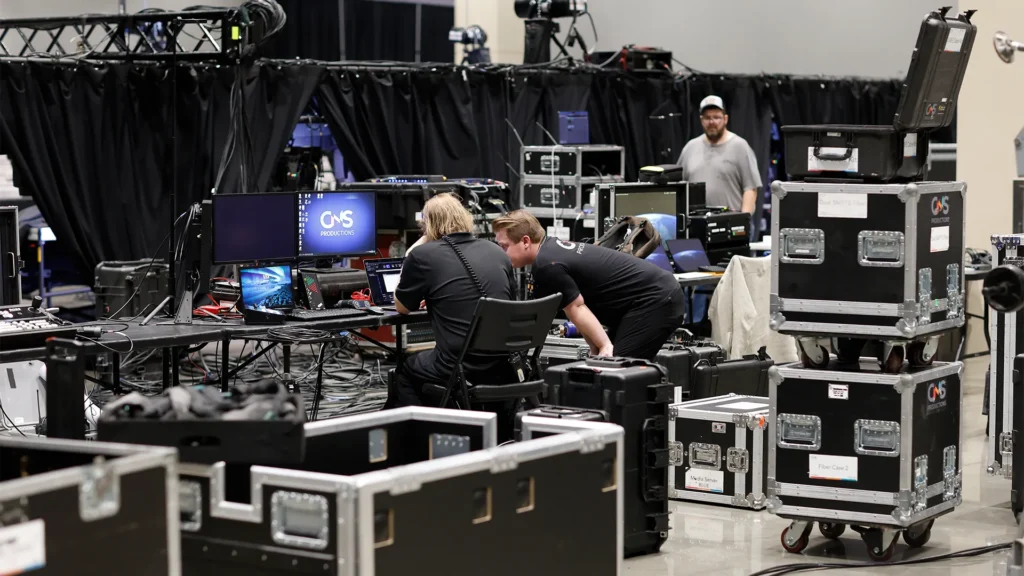 Full service event production team preparing AV equipment and technical systems before a corporate event in Oklahoma City.