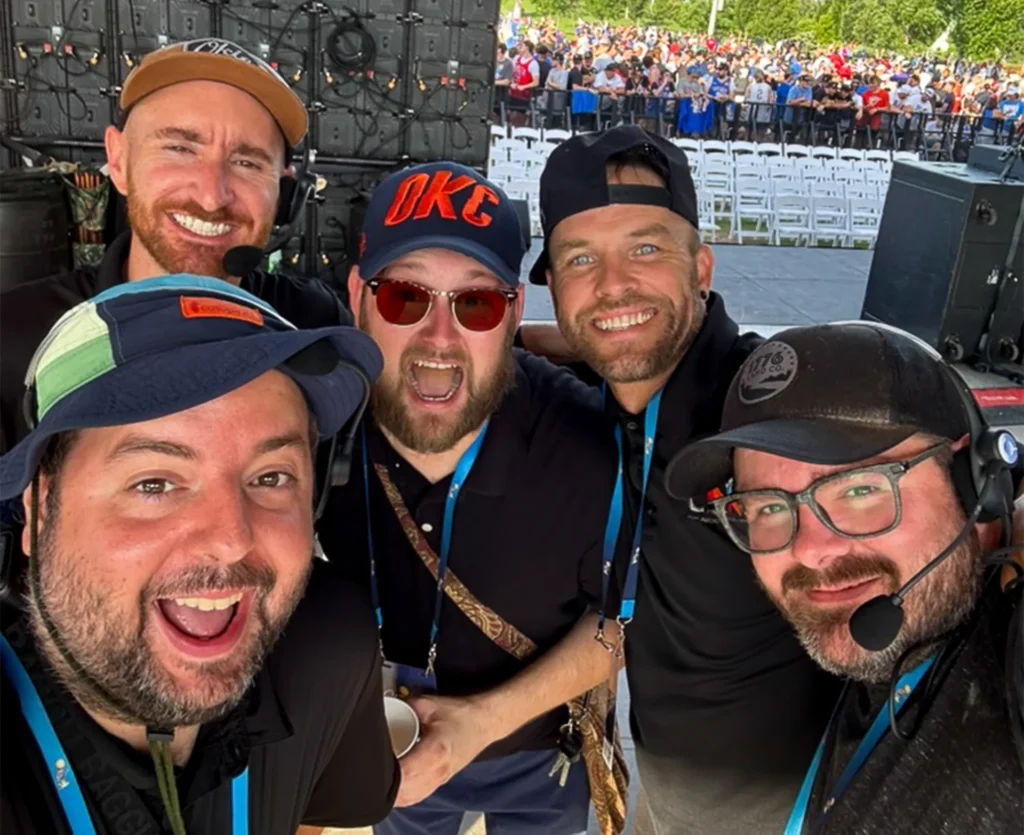 CNS production team supporting a live event in Oklahoma City with an LED video wall and crowd behind them.